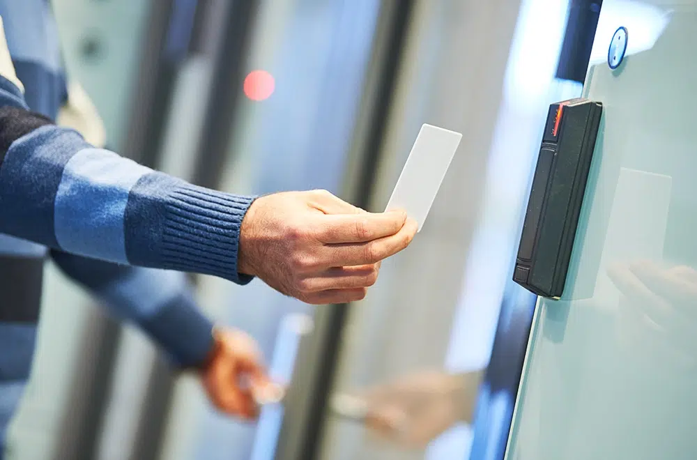 a man accessing a card access door